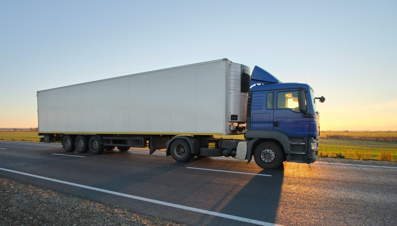semi-truck-with-cargo-trailer-driving-on-highway-h-2024-12-06-11-28-15-utc.jpg