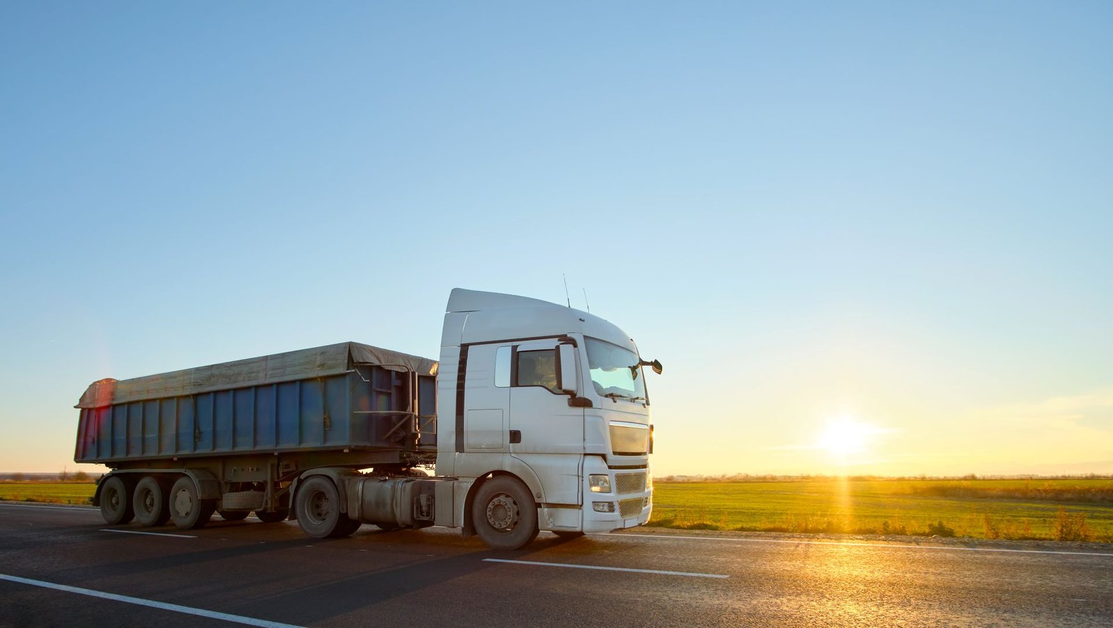 semi-truck-with-tipping-cargo-trailer-transporting-2024-12-06-23-10-59-utc.jpg